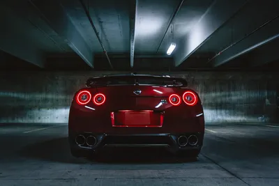 Red night nissan gt-r on the background of the bridge - desktop wallpapers