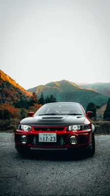 Скачать 938x1668 mitsubishi lancer evolution, mitsubishi, автомобиль,  красный, черный, вид спереди обои, картинки iphone 8/7/6s/6 for parallax