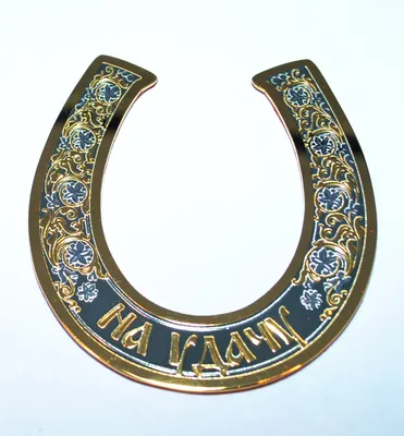 A horseshoe hanging on a wooden wall - wallpapers for your phone