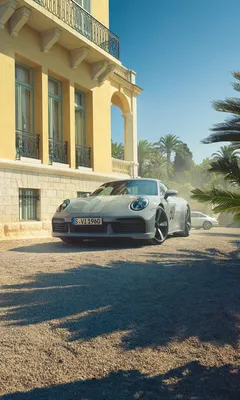 Grey and black Porsche 911 GT3 rs in front of a white and black villa with  a pool | Wallpapers.ai